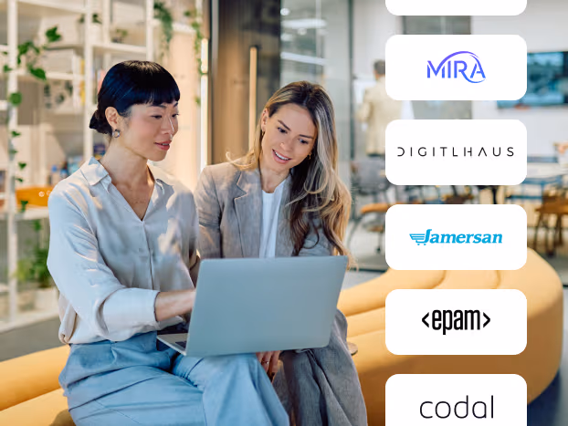Two professionals collaborating on a laptop alongside agency partner logos for MIRA, Digitlhaus, Jamersan, EPAM, and Codal.